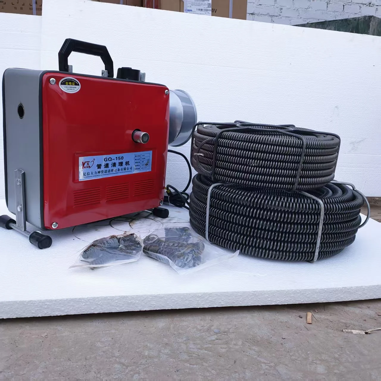 GQ-150 machine pictured with cable coils and cleaning tools